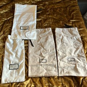 Guaranteed authentic Gucci dust bags. 2 linen 17” X 8.5”. 2 silk.